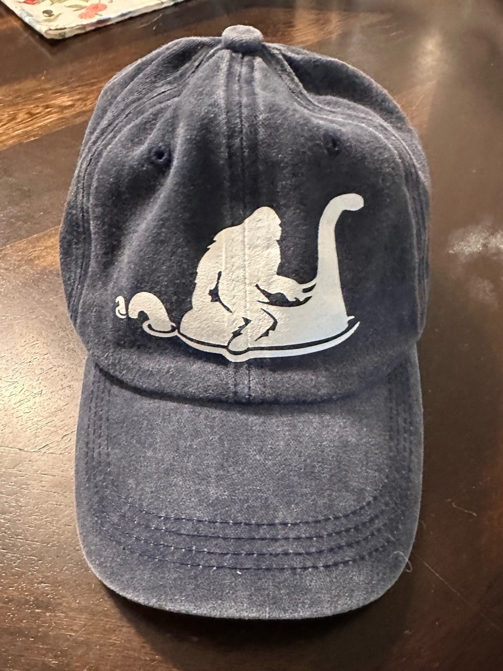 Navy Baseball Cap with White Sasquatch & Nessie Graphic